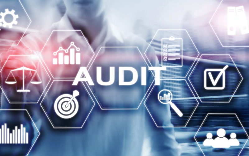 preparing for your audit Some machinery on a blue background overlaid with the word audit.